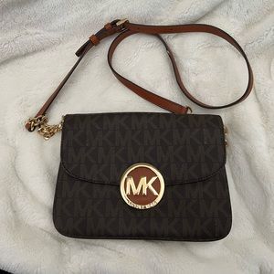 Michael Kours cross body purse.  Never used with tags.